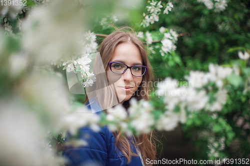 Image of woman portrait in the garden of apple