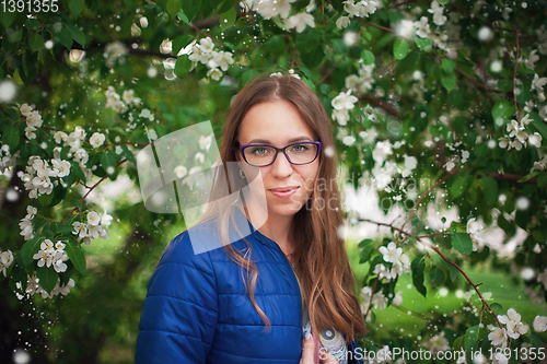 Image of woman portrait in the garden of apple