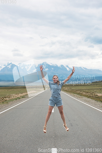 Image of Woman sitting on the road