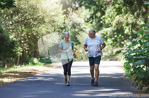 Image of Senior couple, exercise and happy outdoor for a run, workout and training on road for fitness. Elderly man and woman talking about cardio for health and wellness while jogging or running in nature