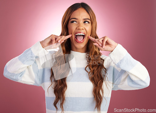 Image of Cute smile, happy woman and youth in a studio with a gen z female in isolated pink background. Happiness, fun and silly young person with casual fashion feeling crazy and playful from funny joke