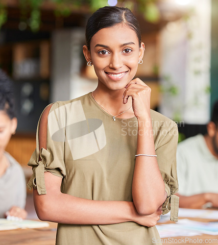 Image of Portrait, mindset and designer with a business woman in the office, standing as a leader with her team in the boardroom. Face, vision and mission with a young female employee looking confident