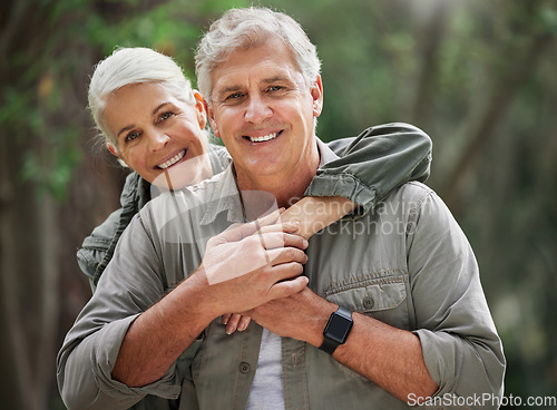 Image of Nature, hiking and portrait of senior couple with smile on adventure in forest, woods and mountain for exercise. Fitness, retirement and happy elderly man and woman hug on hike for travel wellness