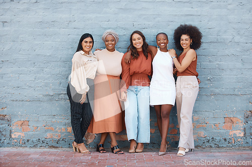 Image of Portrait, group and business women smile standing on brick wall with mockup outdoors in city. Cooperation, teamwork hug and diversity, collaboration and friends, people and employees with happiness.
