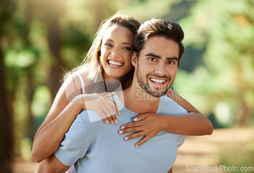 Image of Couple in nature, piggy back in portrait and happy relationship, love and trust with travel and adventure outside People in forest, outdoor and happiness together with smile, commitment and hug