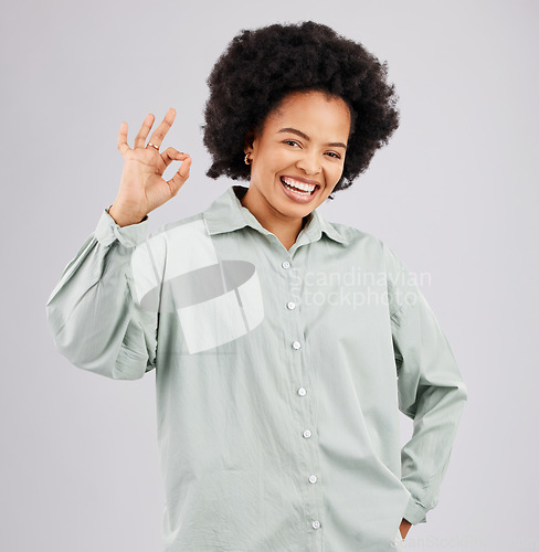 Image of Happy, perfect and portrait of a black woman with a sign isolated on a white background in studio. Smile, ok and an African girl with a hand gesture for success, agreement and happiness on a backdrop