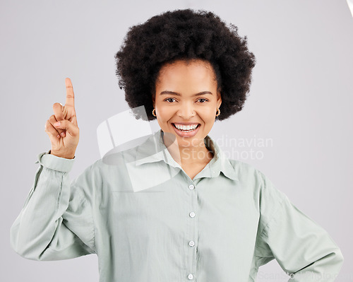 Image of Woman portrait, up direction and idea hand sign with a smile in a studio with a solution to a question. Isolated, white background and female feeling happy and confident from inspiration and ideas