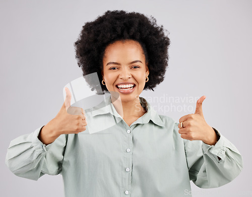 Image of Portrait, thumbs up and black woman laughing in studio isolated on a white background. Success, happiness and person with hand gesture or emoji for winning, approval or agreement, like or thank you.