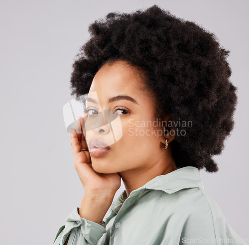 Image of Beautiful, serious and portrait of a black woman with an afro isolated on a white background in a studio. Skincare, calm and face of an African girl with a glow, looking confident and relaxed