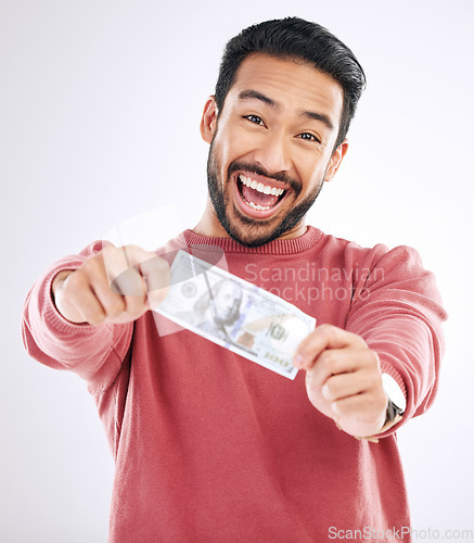 Image of Dollar, money and excited portrait of man on studio background for investment, financial savings and payment. Finance profit, winner and happy male for winning, cash bonus and stock market success