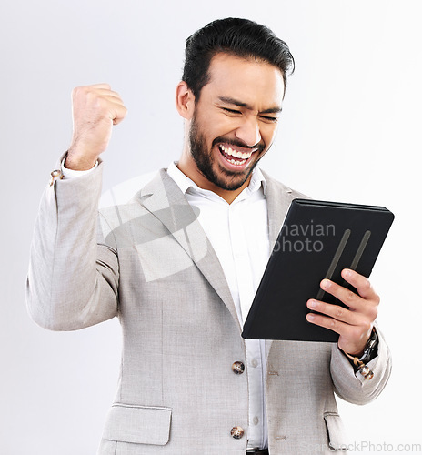 Image of Tablet, news and business man celebrate achievement, success goals or reading winning announcement. Excited, studio winner and happy male fist pump, victory or salary notification on white background