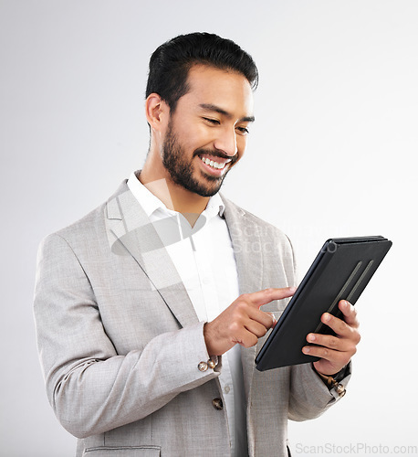 Image of Smile, business and Asian man with tablet, typing and connection isolated on a white studio background. Japanese male ceo, employee and entrepreneur with device, scroll and network for online reading