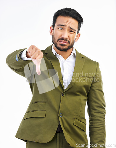 Image of Thumbs down, business man and sad portrait in a studio with bad feedback, voting and emoji hand sign. Negative opinion, decision and wrong hands gesture of a upset male with isolated white background