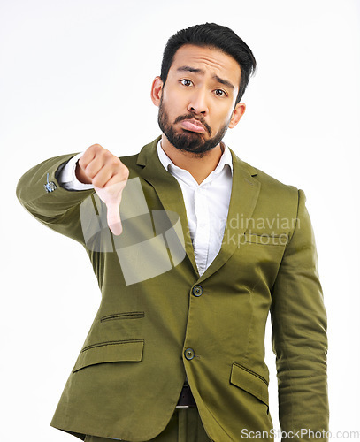 Image of Thumbs down, sad man and portrait in a studio with bad feedback, voting and emoji hand sign. Negative opinion, decision and wrong hands gesture of a upset business man with isolated white background