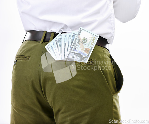 Image of Closeup, dollar and man in studio for money laundering, scam and bribe while posing against white background. Pocket, cash and businessman stealing, fraud and corruption, crime and secret payment