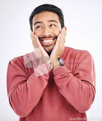 Image of Happy, smile and man in a studio looking cute and handsome while thinking. Isolated, white background and male model with a cheerful, silly and happiness pose dreaming about an idea with backdrop