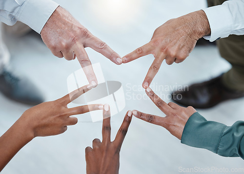 Image of Teamwork, peace sign and hands of business people for support, motivation and goals in office. Collaboration, solidarity and diversity above of men and women with mission star, trust and cooperation