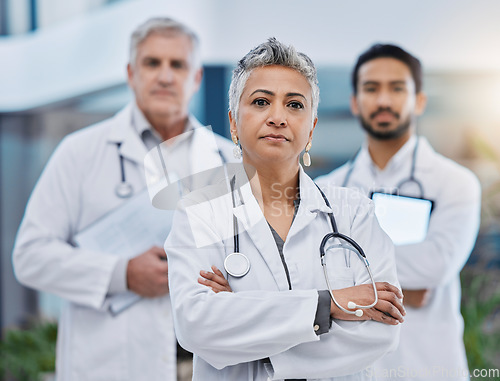 Image of Senior woman, doctor team portrait and leadership outdoor feeling serious with vision. Healthcare, wellness and professional group with arms crossed and vision ready for medical and clinic teamwork