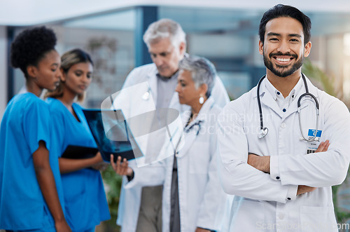 Image of Man doctor, hospital team and leadership portrait outdoor feeling serious with vision. Healthcare x ray, wellness and nursing group with arms crossed and stethoscope ready for medical teamwork