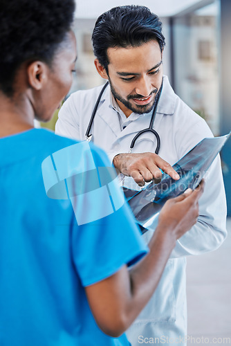 Image of X ray, mri analysis and doctor team with conversation and medical collaboration in a hospital. Healthcare, clinic and nurse worker with an xray doing problem solving with professional assessment