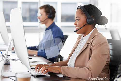 Image of Black woman, call center and typing on computer, smile in office and working on customer service in workplace. Telemarketing, desktop and happiness of person, female sales agent or consultant writing