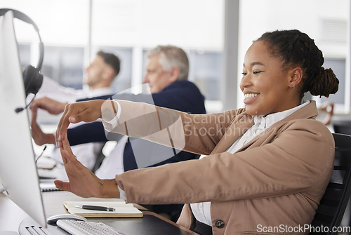 Image of Woman, call center and stretching hand at desk for exercise, muscle wellness and relief for stress with smile. Business people, customer service staff and health of hands in training at team building