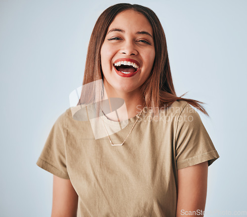 Image of Happy, laughing and portrait of a cheerful woman isolated on a white background in studio. Smile, funny and a beautiful young girl with happiness, smiling and positivity on a backdrop for expression