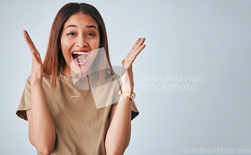 Image of Happy, wow and portrait of woman in studio for good news, surprise and announcement on grey background. Face, emoji and female excited for deal, sale or promotion, omg and open mouth while isolated