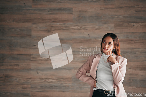 Image of Thinking, business woman and studio idea for person contemplating plan, solution or problem solving ideas. Brainstorming entrepreneur, thoughtful and mockup entrepreneurship on wooden wall background