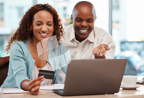 Image of Laptop, credit card and couple online shopping in home, payment or digital banking. Ecommerce, computer and happy black man and mature woman with fintech, sales or interracial purchase on web store.