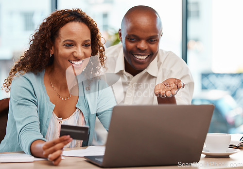 Image of Laptop, credit card and couple online shopping in home, payment or digital banking. Ecommerce, computer and happy black man and mature woman with fintech, sales or interracial purchase on web store.