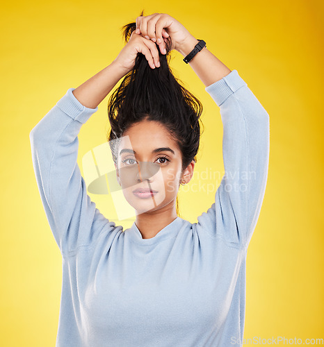 Image of Portrait, hair care and beauty of woman in studio isolated on a yellow background. Natural, balayage and female model with long hairstyle growth, serious cosmetics and aesthetics for salon treatment