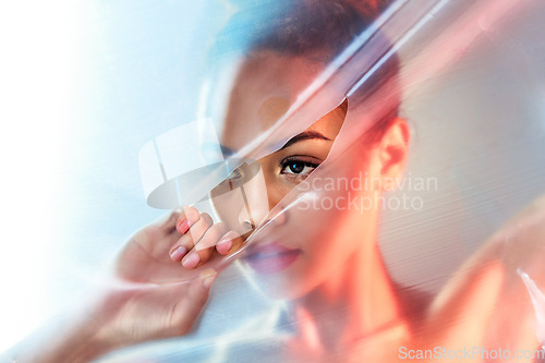 Image of Plastic tear, makeup and face of woman with beauty products, cosmetics and skincare in studio. Creative art deco, aesthetic and eyes of girl with glow, lipstick and luxury style with neon packaging