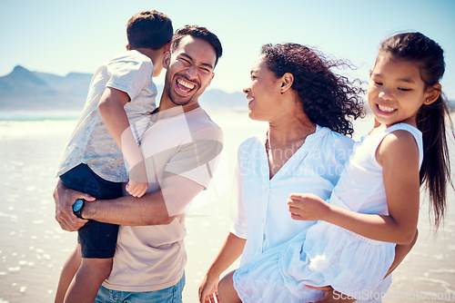 Image of Happy family, laughing and beach hug of a mother, father and girl together by the ocean. Nature, sea and love of a mom, dad and child from the Philippines on vacation with parents on travel holiday