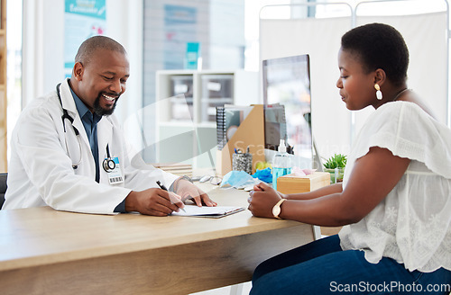 Image of Doctor, writing on clipboard and consultation with black woman for health checkup. Healthcare, paperwork and happiness of medical professional with patient, checklist and results in hospital clinic.