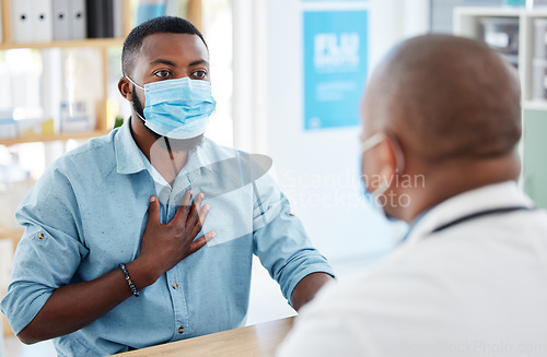 Image of Doctor, chest pain and patient with covid in hospital for symptoms, breathing problem and consultation. Healthcare, sick black man and medical professional with face mask for treatment in clinic.