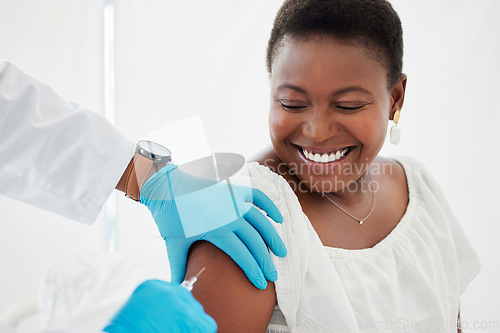 Image of Doctor, black woman and vaccine injection with smile for safety, immunity and prevention. Covid, healthcare and medical professional with vaccination, cure or medicine for happy patient in clinic.