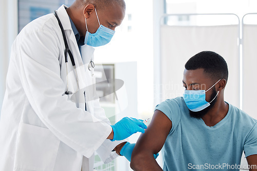 Image of Doctor, black man and vaccine injection for covid safety, immunity and prevention. Face mask, healthcare and medical professional with vaccination syringe, cure or medicine for patient in clinic.