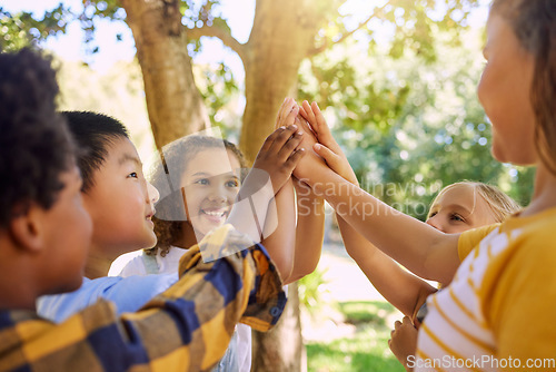 Image of Happy, playing and children with a high five for a game, support and team building at a park. Smile, together and friends with hands for motivation, connection and celebration at a summer camp