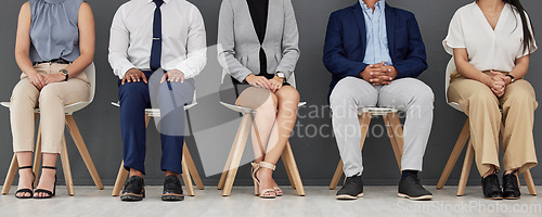 Image of Line, waiting and business people sitting for an interview in the office with corporate outfits. Diversity, recruitment and professional employees ready for an employment or hr meeting in a workplace