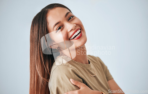 Image of Woman is laughing, happiness and portrait with confidence isolated on studio background, comedy and carefree. Happy, young female and joy with laugh, funny and mockup with humor and positive smile