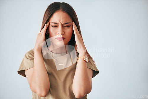 Image of Headache, stress and woman in studio with anxiety, temple massage and pain on mockup background. Burnout, brain fog and girl suffering migraine, vertigo or dizzy, fatigue or frustrated by problem