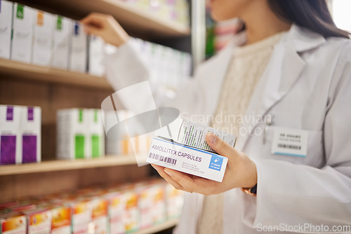 Image of Pharmacy, tablet box in hand and woman pharmacist in drug store, pills choice and medical healthcare. Prescription drugs, health and treatment for illness, pharmaceutical and medicine professional