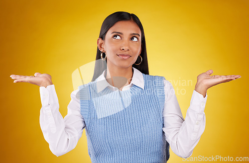 Image of Choice, thinking and offer with woman in studio for decision, confused and option mockup. Why, show and uncertain with female holding on yellow background for product placement, doubt and results