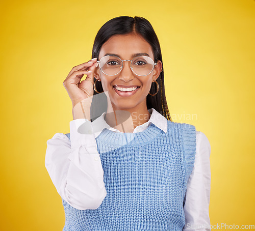 Image of Glasses, happy and portrait of woman in studio for eyewear, vision and confidence. Optometry, nerd and happiness with female and spectacles isolated on yellow background for pride, young and eye care