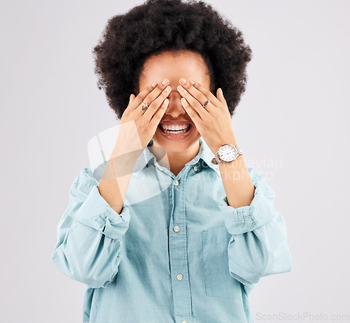 Image of Eyes, cover and surprise with woman in studio for celebration, announcement and reaction. Happy, smile and funny with female hiding isolated on white background for expression, excited and wow