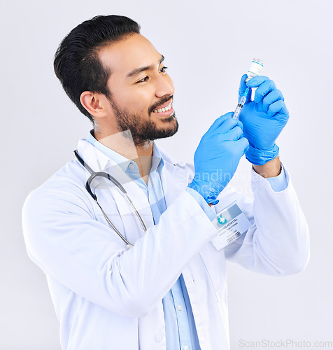 Image of Doctor with smile, syringe and vaccine in studio for healthcare, medicine and innovation in medical science. Vaccination, booster shot in bottle and needle, health care and help with virus protection