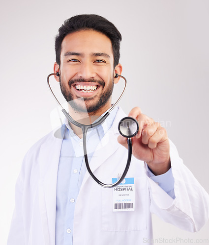 Image of Happy asian man, doctor and portrait with stethoscope for healthcare cardiology against a white studio background. Male medical professional with smile for checkup, heart beat or life insurance