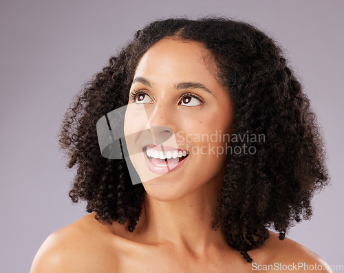 Image of Skincare, beauty and happy woman in a studio with a self care, natural and facial treatment. Happiness, smile and female model from Mexico with a cosmetic face routine isolated by a gray background.