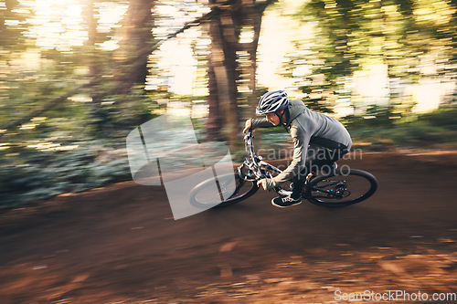 Image of Fitness, cycling, and fast with man in nature for training, extreme sports and motion blur. Workout, race and speed with cyclist on bike in forest park for performance, challenge and adventure